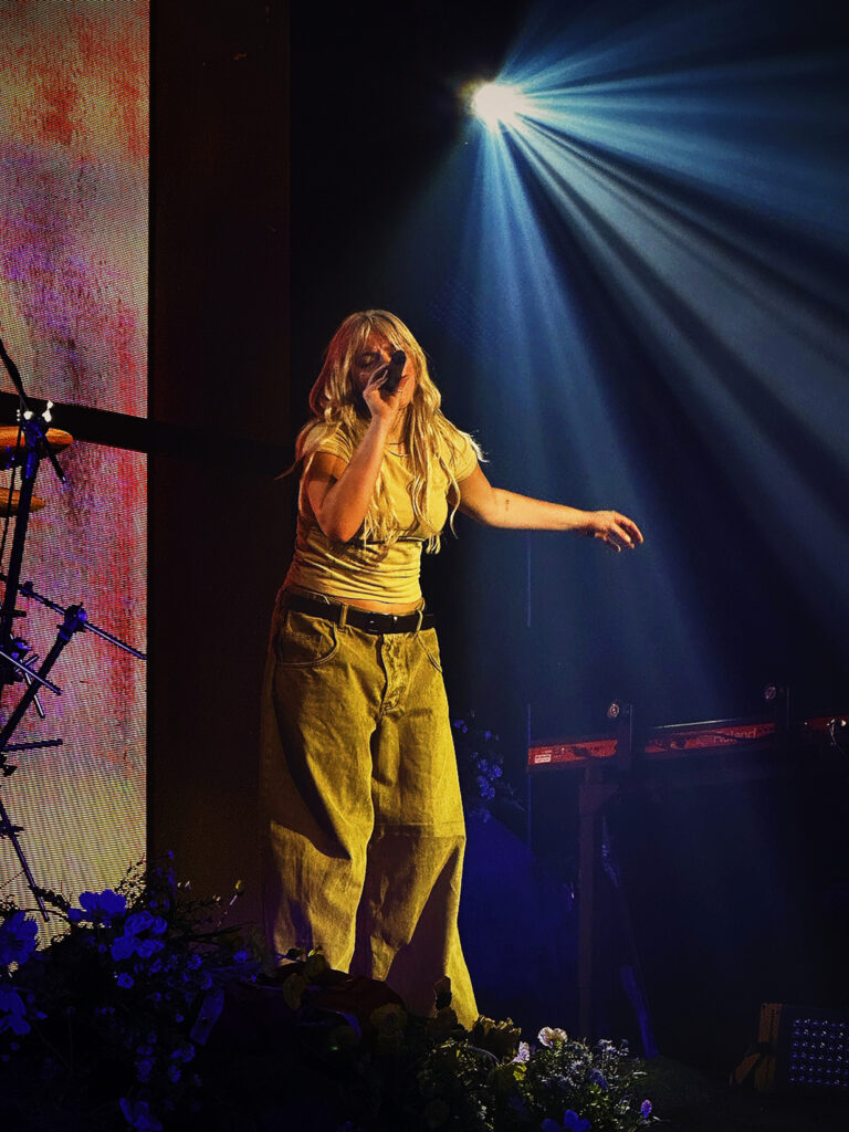 A photo of Renee Rapp. it is the photo I took of her when I went to my very first concert.